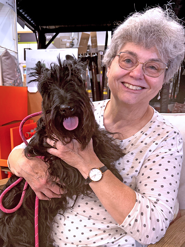 Happy woman with Scottish Terrier